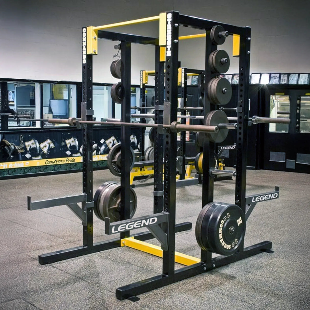 Black Legend Fitness double-sided weightlifting power rack with weights in a gym setting