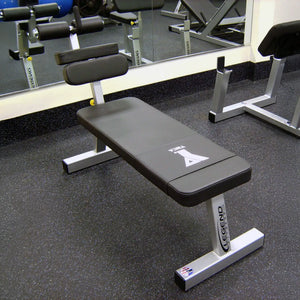 A black and gray ab bench in a gym setting