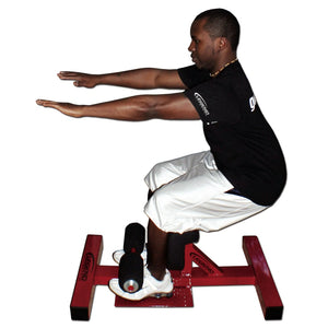 A man using a black and red Sissy Squat fitness machine on a white background