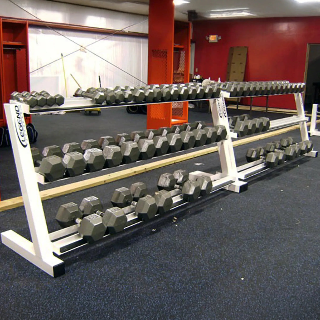 Dumbbell racks with dumbbells on them in a gym setting