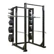 Black power rack with weight plates on a white background