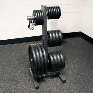 Set of weight plates on a stand in a gym setting