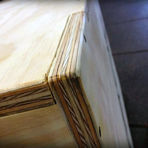 Close up image of a corner on a wooden plyometric box