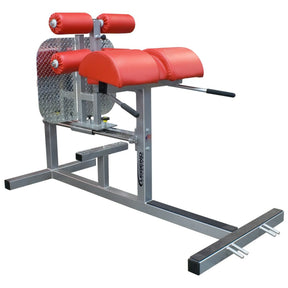 A silver glute ham developer fitness machine with red pads on a white background