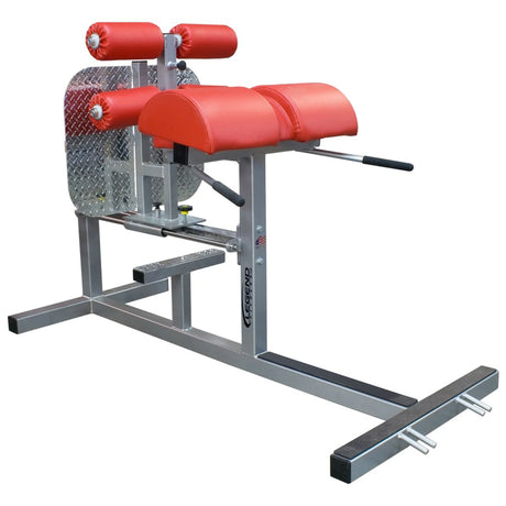 A silver glute ham developer fitness machine with red pads on a white background