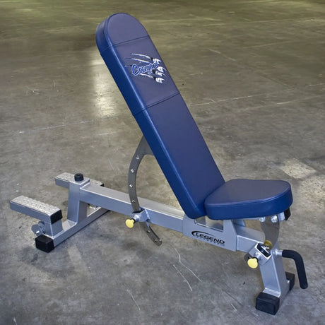 Blue weight bench with 'Legend' branding on a concrete floor