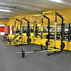 Yellow weightlifting equipment in a gym setting