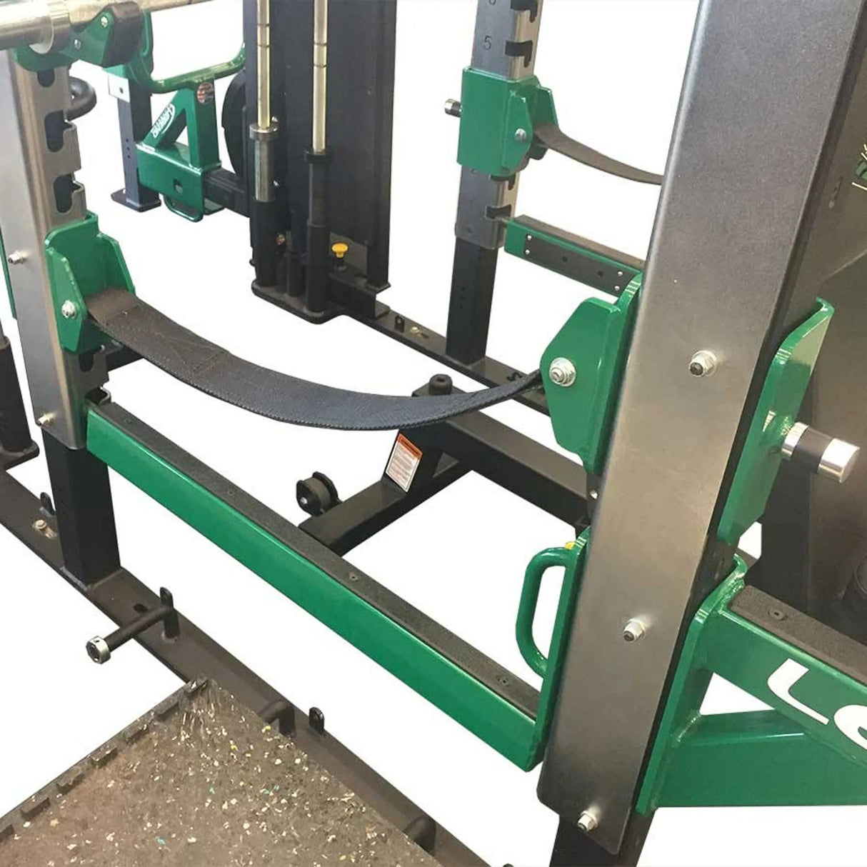 Green and black exercise machine on a white background