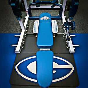 Overhead view of the Legend Fitness 3222-D Bench Docking Kit for Full Cages, featuring a blue and white padded bench, weights, and a large G logo with bulldog mascot on the floor mat.