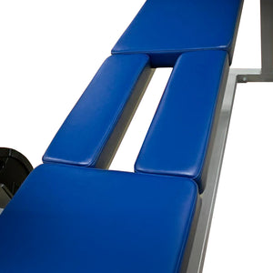 Close up image of a blue prone row weightlifting bench with a white background