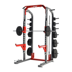 A red and gray Legend Fitness half rack with weight plates on a white background