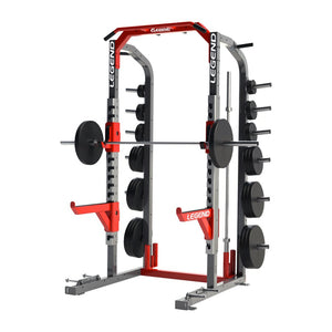 A red and gray Legend Fitness half rack with weight plates on a white background