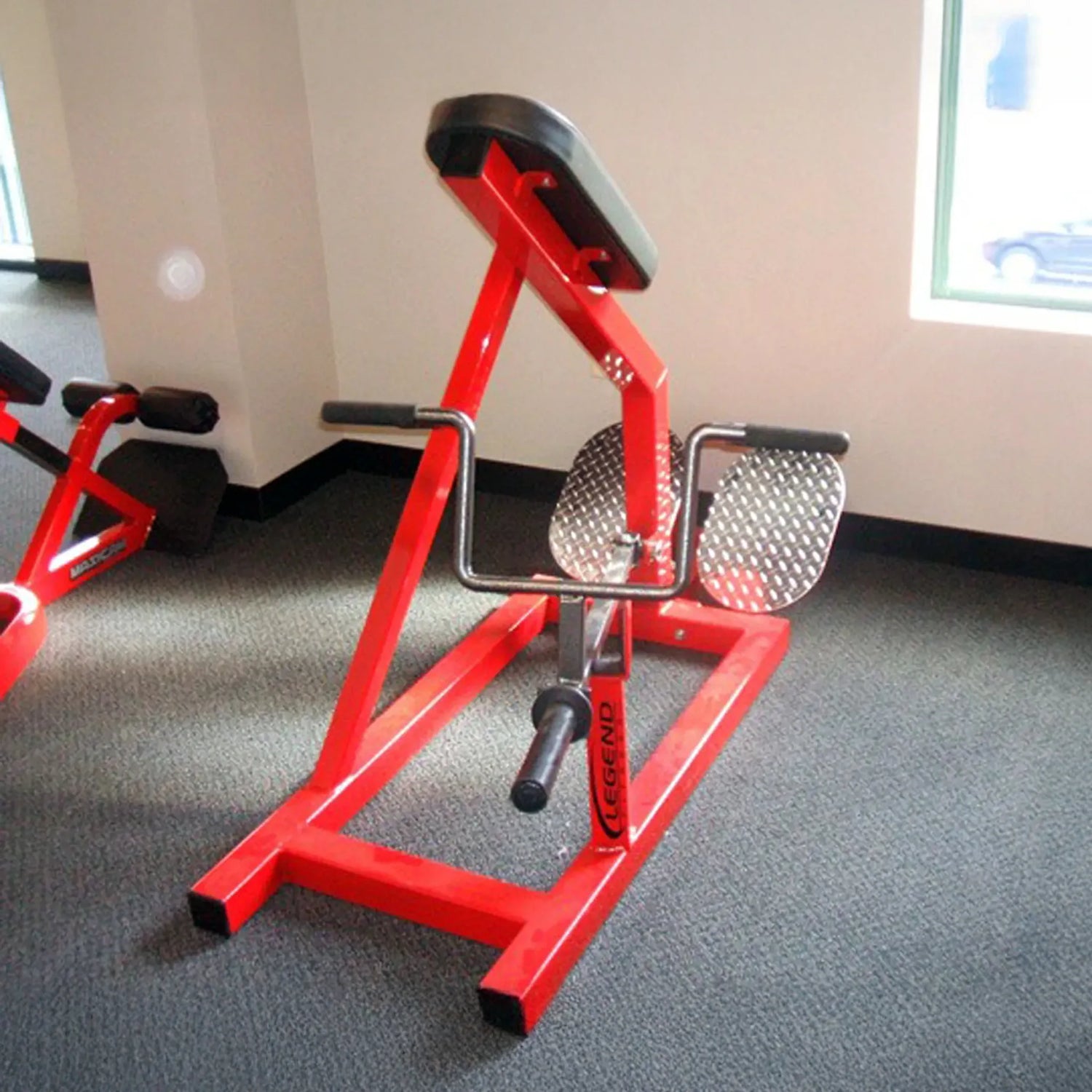 An incline lever row gym machine in a gym