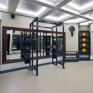 Gym interior with weight rack, mirror, and medicine balls on a shelf.