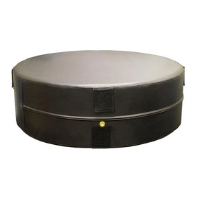 A black round plyometric cushion in a gym setting
