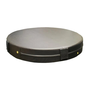 A black round plyometric cushion in a gym setting