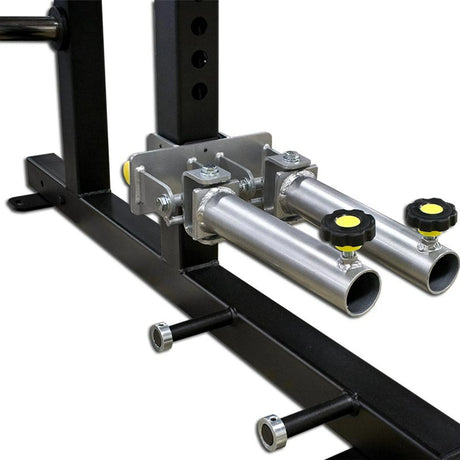 A metal dual landmine attachment mounted to a squat rack on a white background