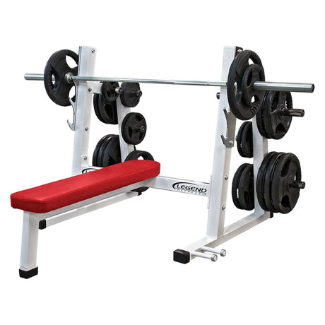 A red and white Olympic flat bench press with black plates on a white background