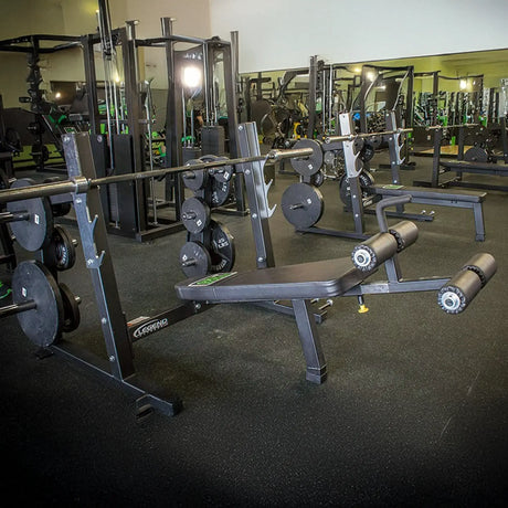 A black decline Olympic bench press in a gym setting