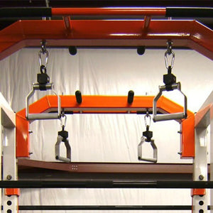 Metal pull-up handles hanging from a squat rack pull-up bar