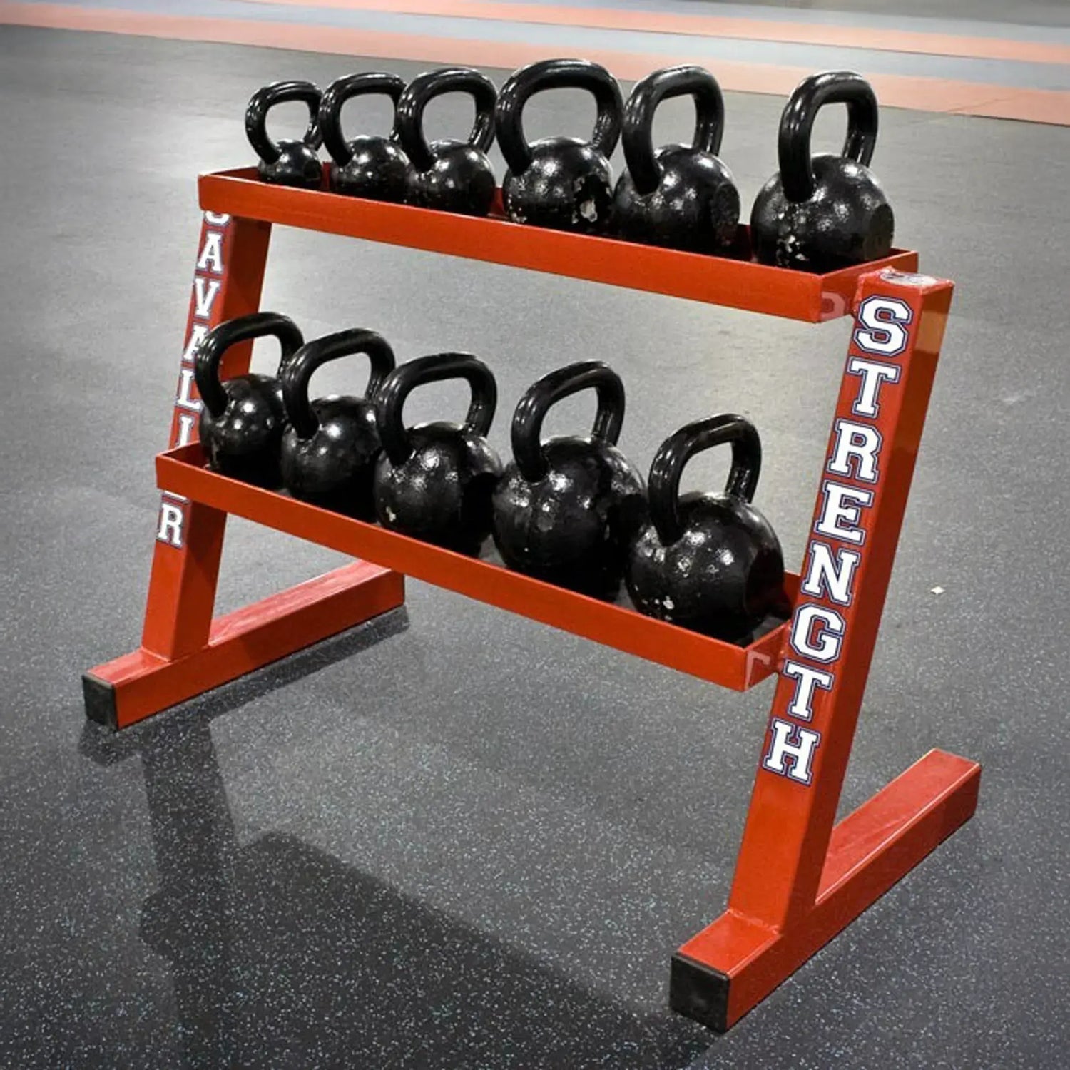 Kettlebell rack with black kettlebells on a gray floor