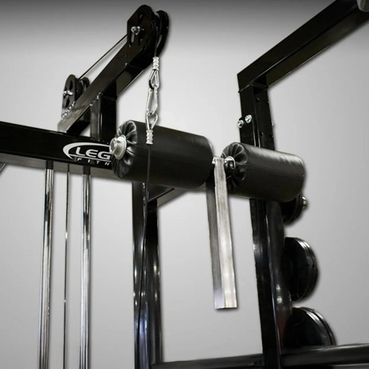 Gym equipment with 'LEGEND FITNESS' branding on a gray background