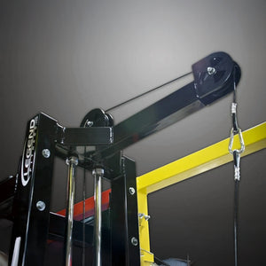 Black weightlifting pulley system with Legend Fitness branding on a gray wall.