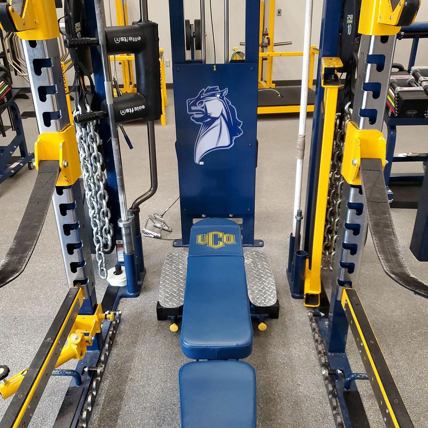 Gym equipment with UCO logo in a fitness center