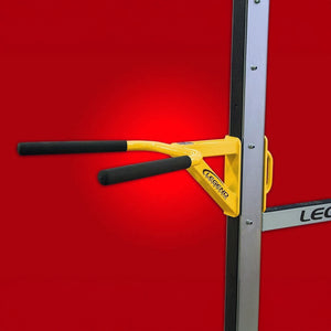 A yellow and black dip attachment mounted to the side of a squat rack with a red background