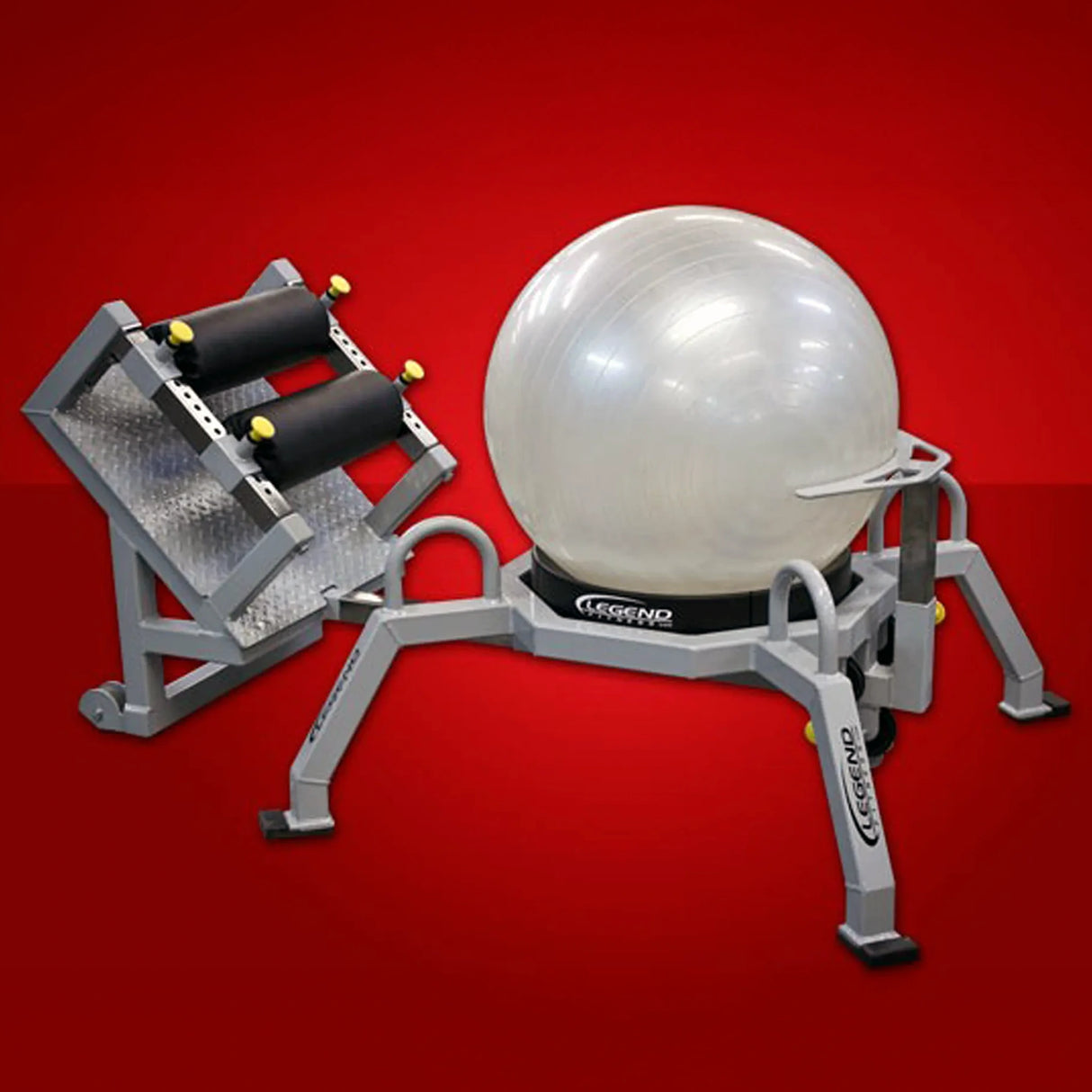 A white fitness ball on a gray and black piece of fitness equipment on a red background