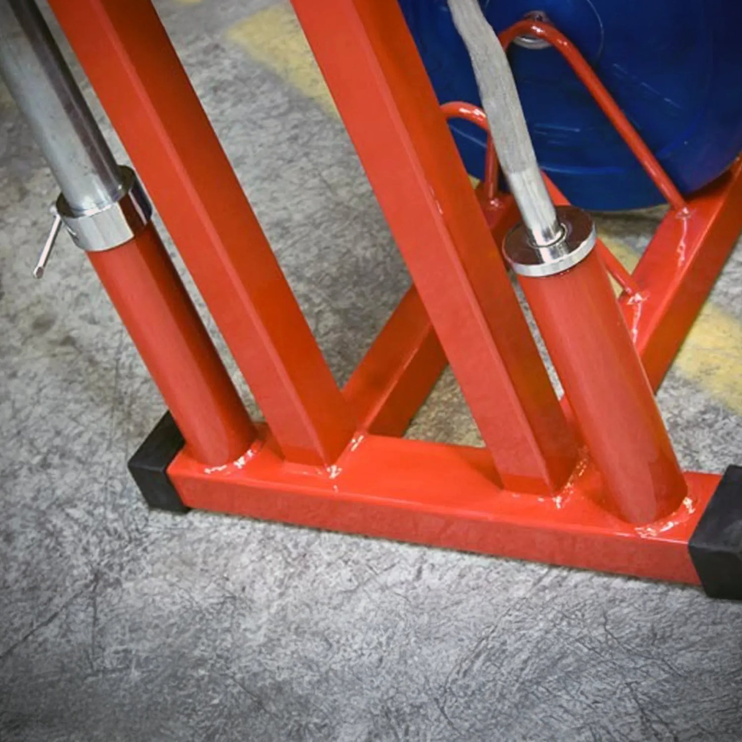 Close up image of a red metal gym equipment storage rack