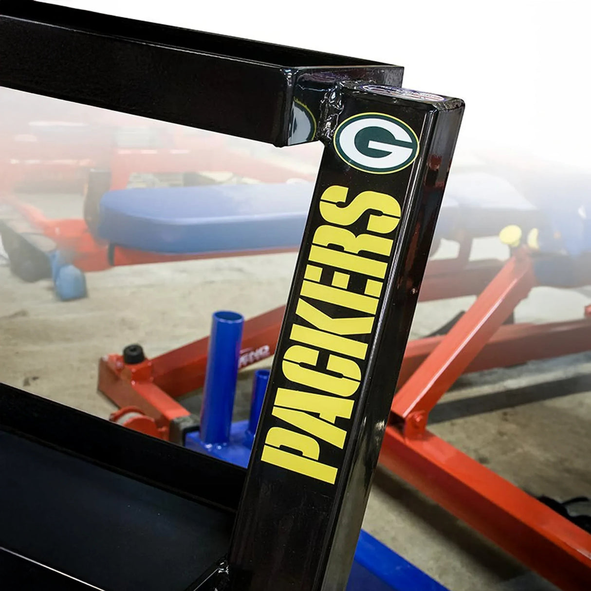Black metal storage unit frame with 'Packers' branding in yellow text on one of the posts, featuring the Green Bay Packers logo.