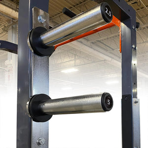Gym equipment with weight bars on a metal frame in a gym setting