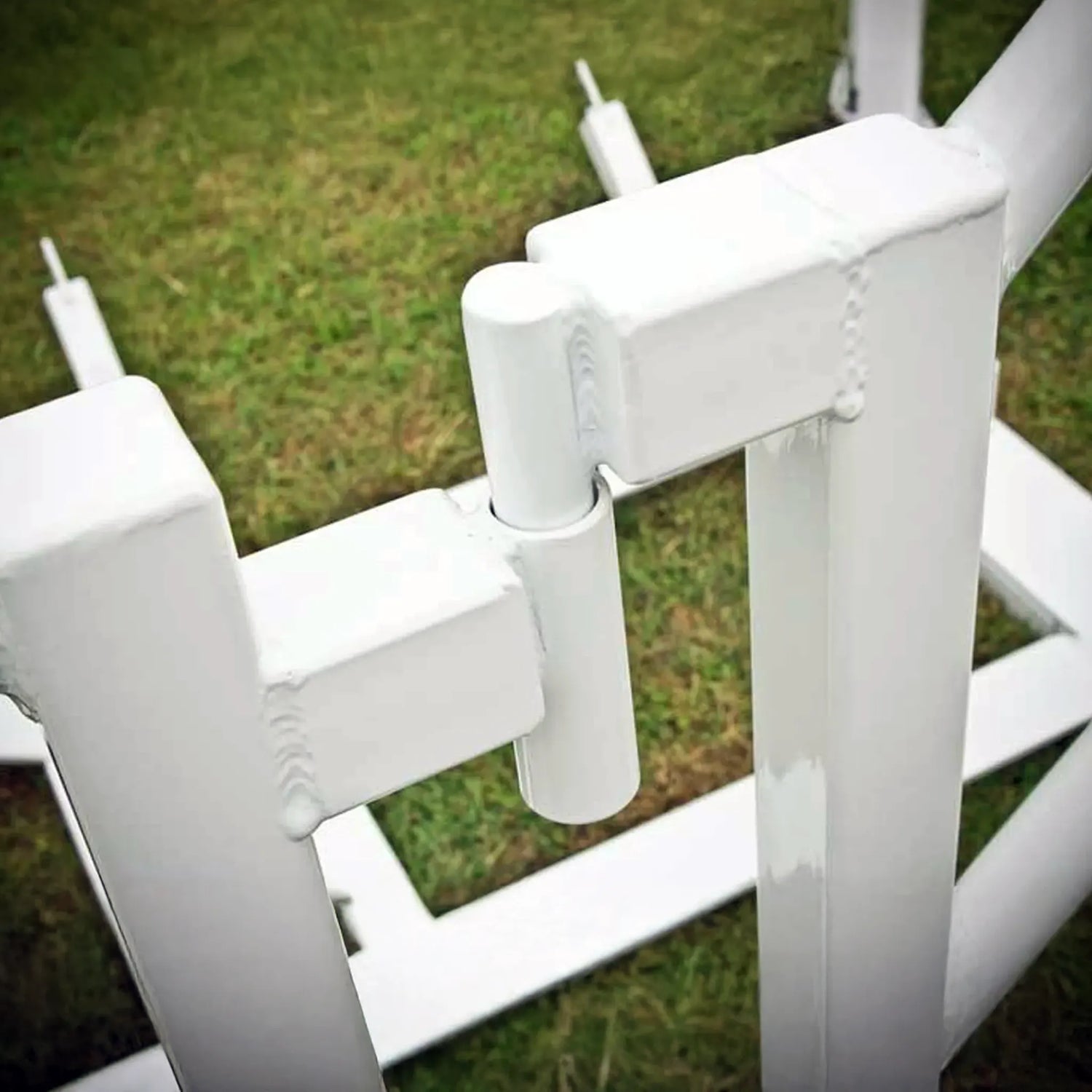 Close-up of a white metal frame on grass