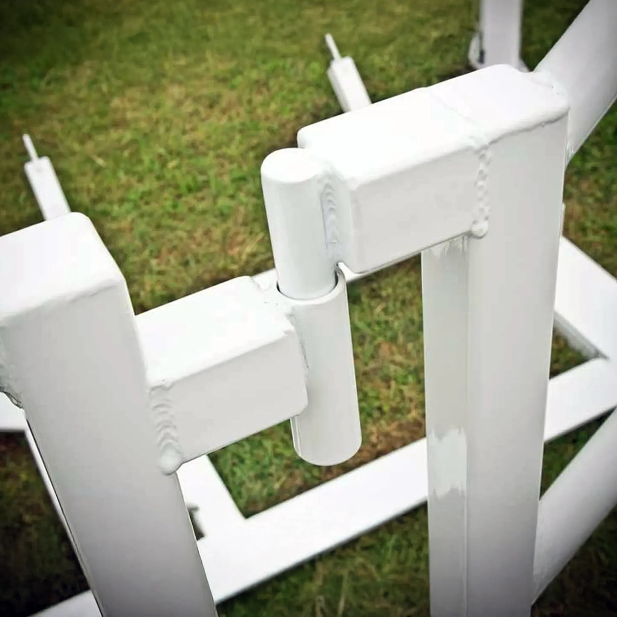 Close-up of a white metal frame on grass