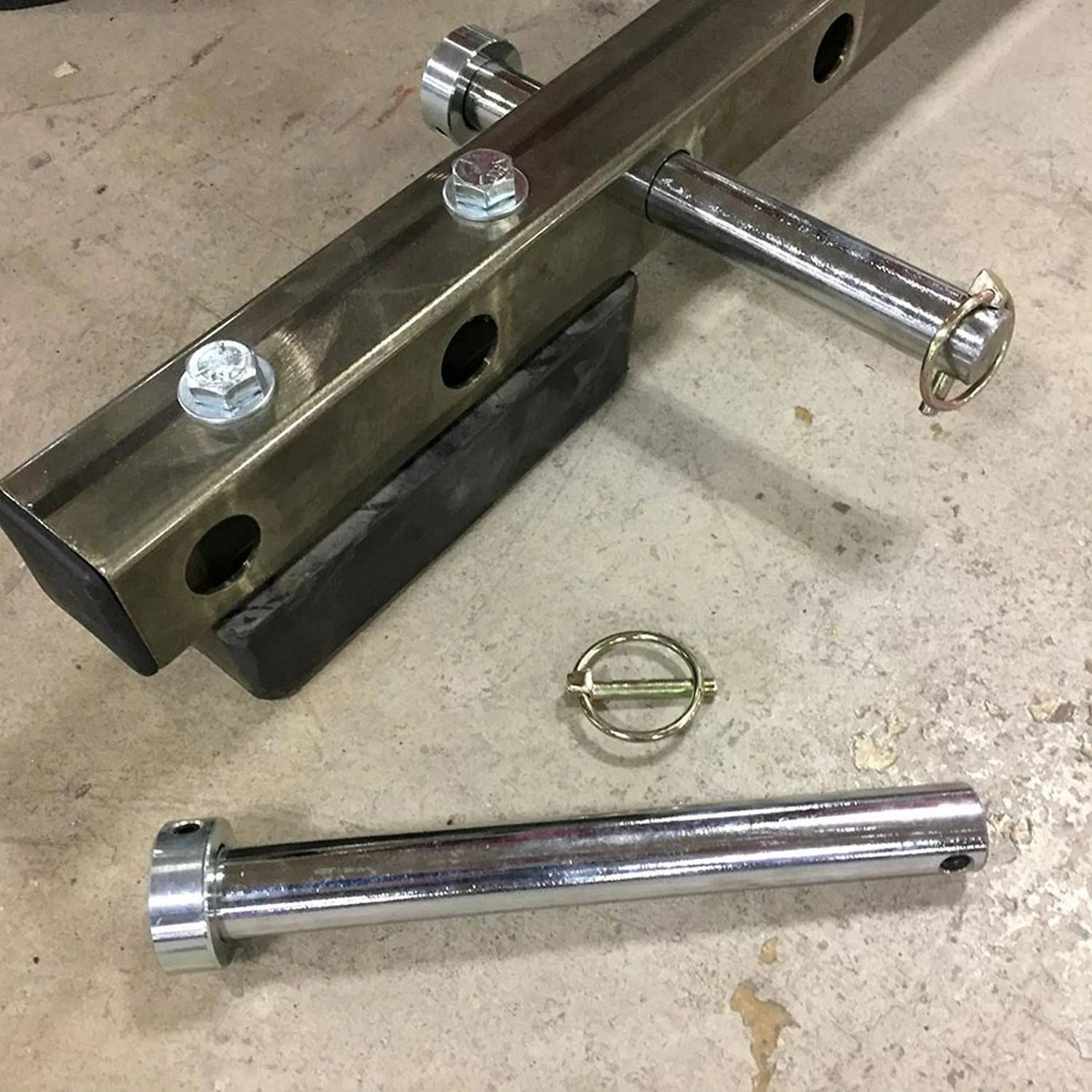 Chrome metal components on a concrete floor