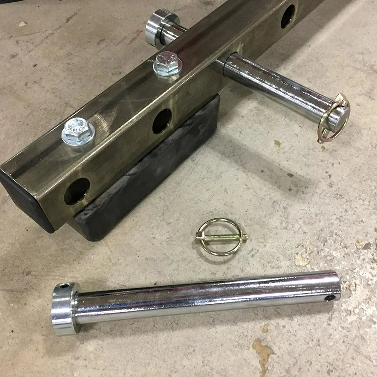 Chrome metal components on a concrete floor