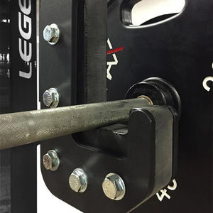 Close-up of a weightlifting bar attached to a squat rack with visible branding.