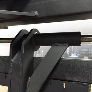 Closeup of black metal parts on a weightlifting machine