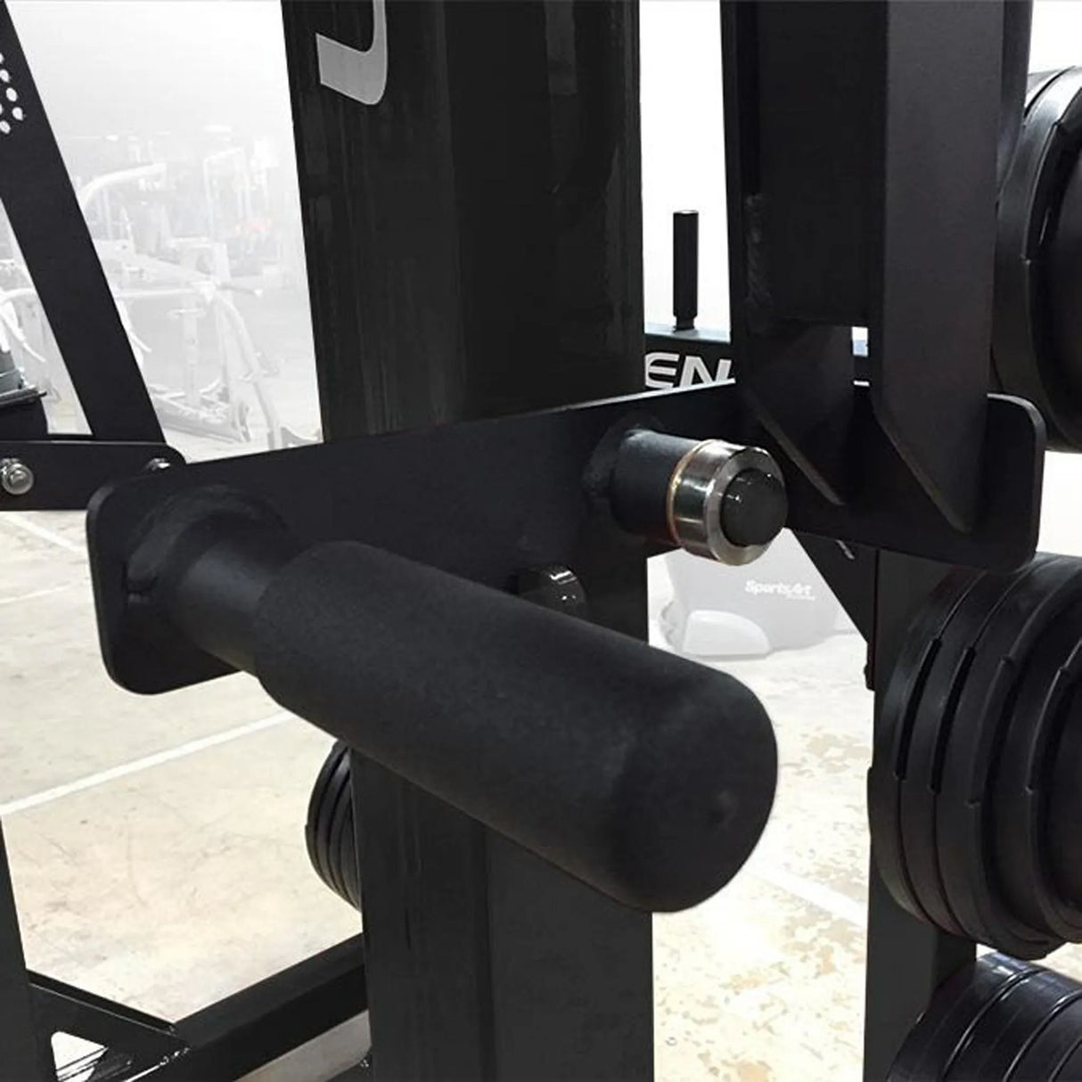 Close-up of a black gym machine with a blurred background