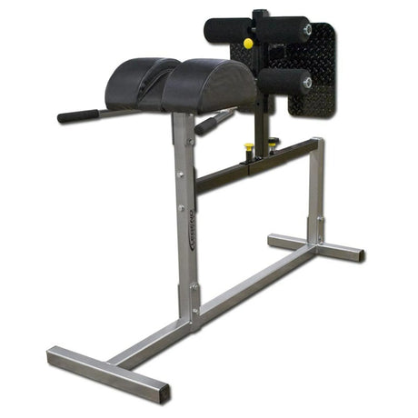 A silver Legend Fitness glute ham developer with black pads on a white background