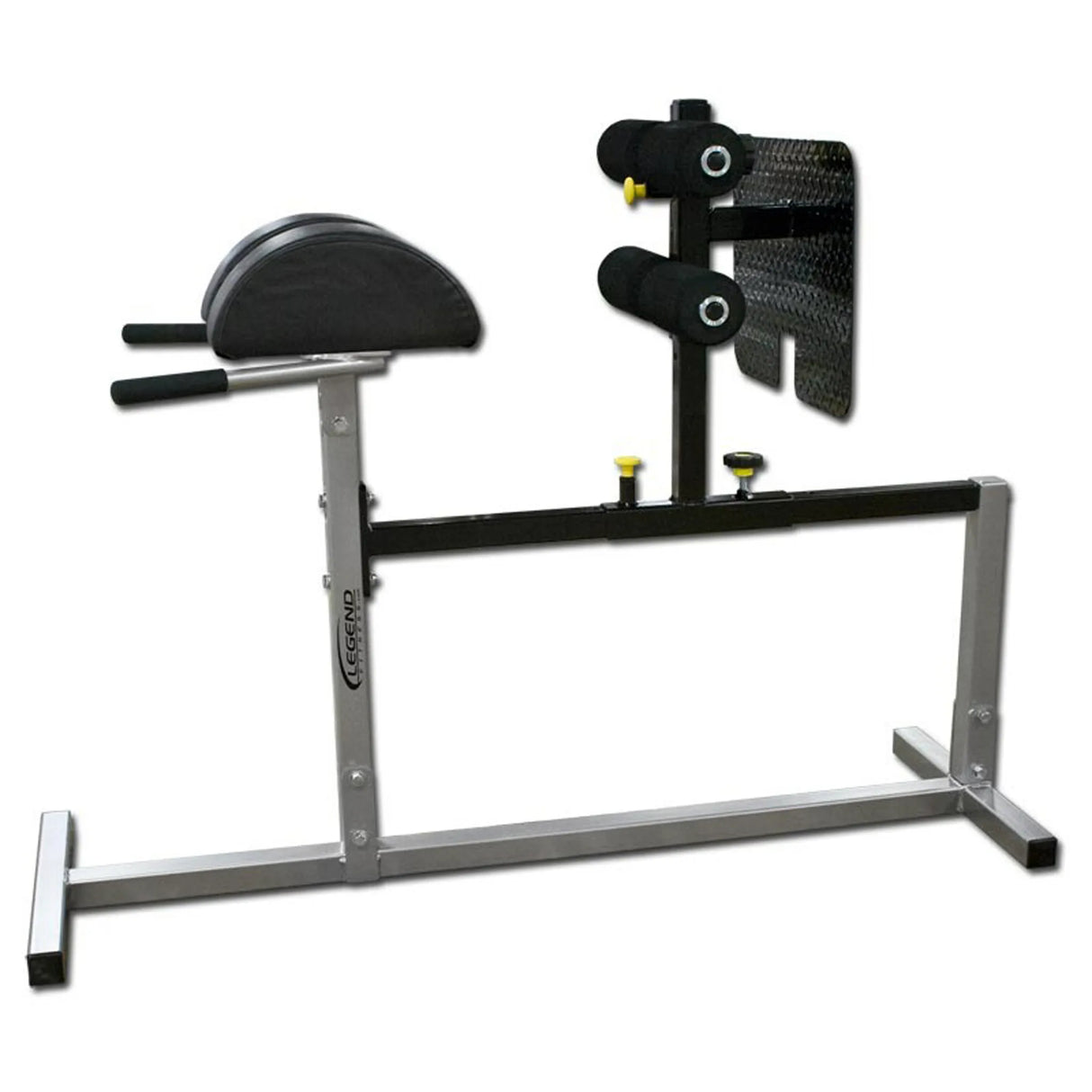 A silver glute ham developer with black pads on a white background