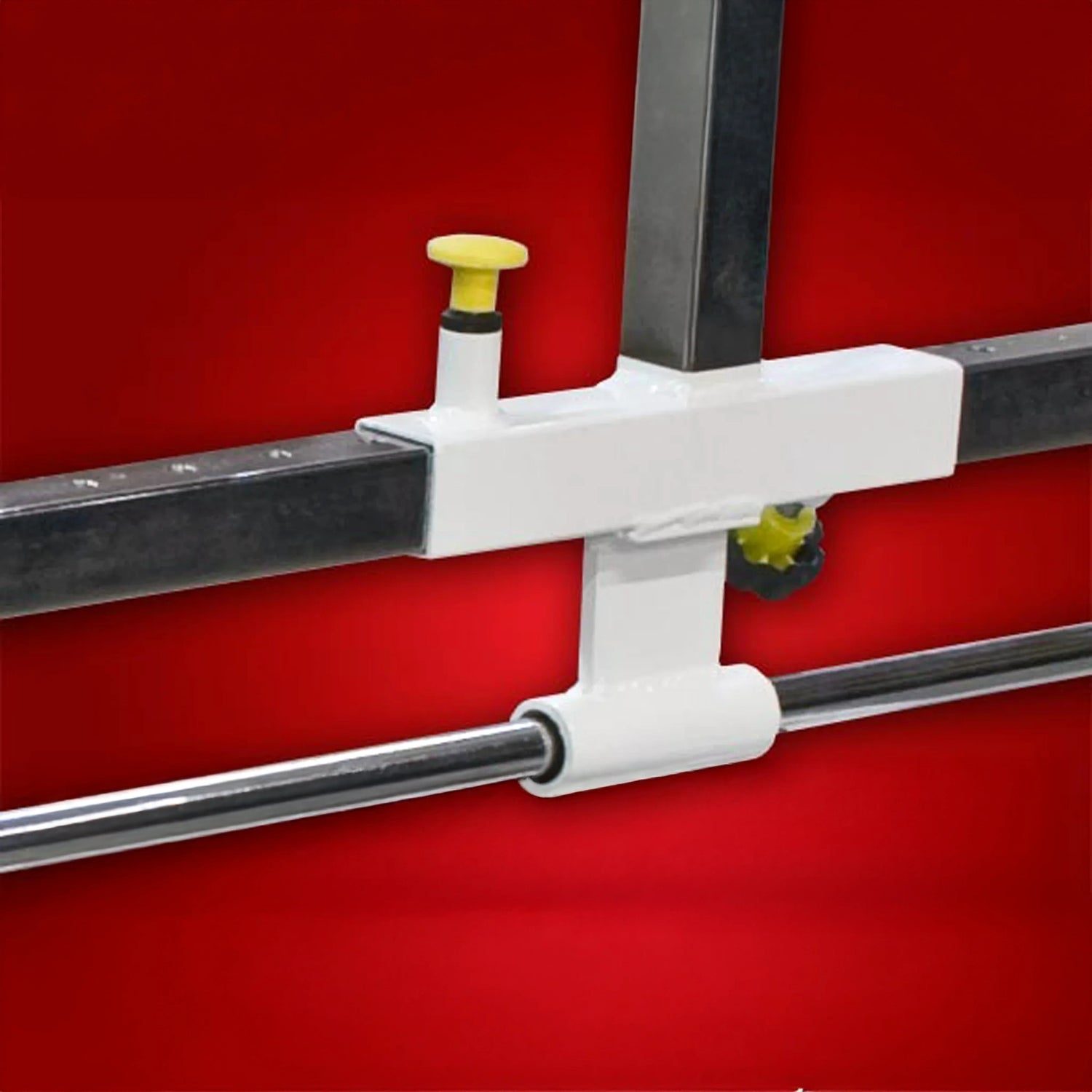 White and silver metal components on a red background