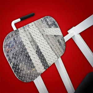 A close-up of the metal diamond plate footrest on the Legend Fitness 914 Supine Leg Press Machine by Legend Fitness, positioned against a solid red background.