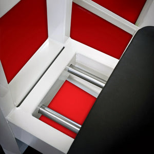 Close-up of the Legend Fitness 914 Supine Leg Press Machine by Legend Fitness, featuring shiny metal bars, a white frame, red panels, and a black padded section visible on the right.