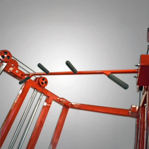 A close-up of the Legend Fitness 953 Functional Trainer Machine—by Legend Fitness—features padded black handles and metal rods against a plain gray background.