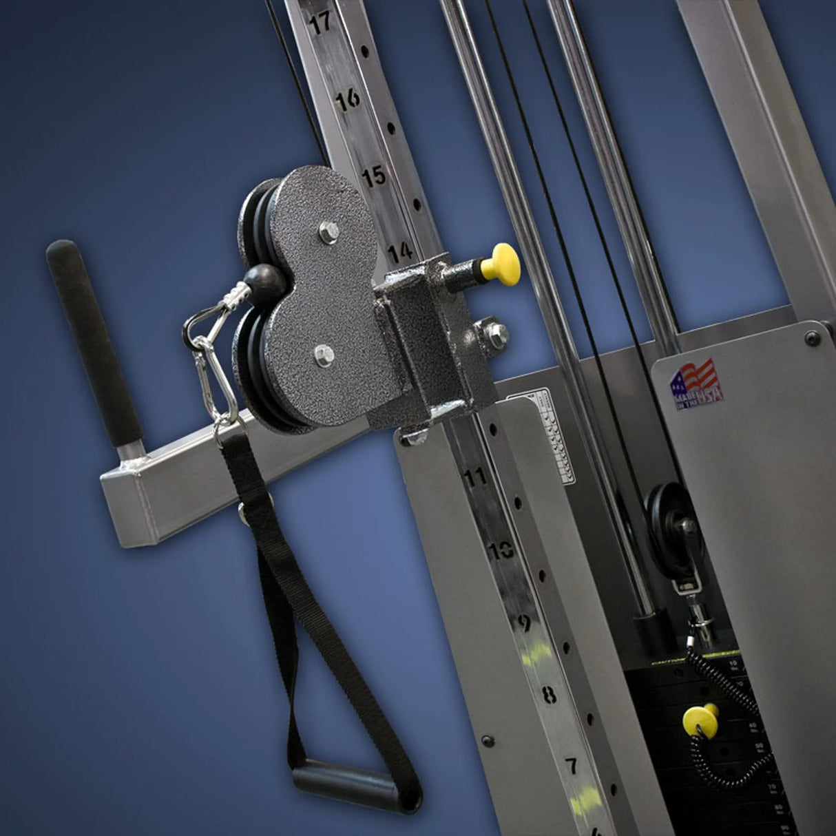 Close-up of the Legend Fitness 954 Cable Crossover with Adjustable Pulleys, featuring a black handle, metal frame, height settings, and an American flag sticker, all set against a blue background.