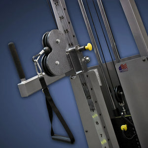 Close-up of the Legend Fitness 954 Cable Crossover with Adjustable Pulleys, featuring a black handle, metal frame, height settings, and an American flag sticker, all set against a blue background.