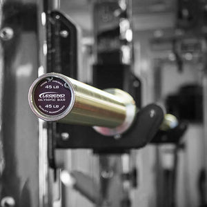 Silver Olympic barbell mounted on a squat rack.