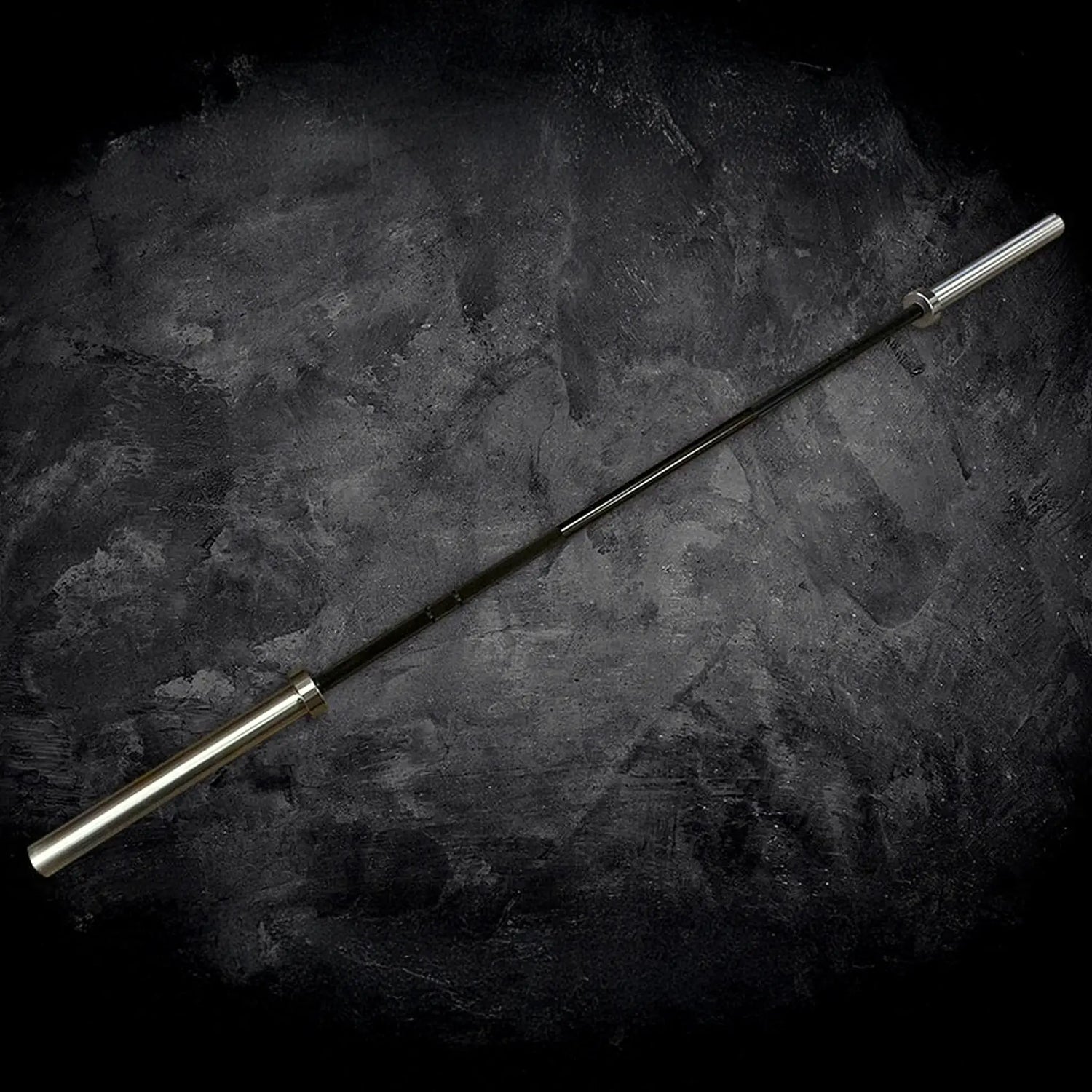 Barbell on a dark textured surface